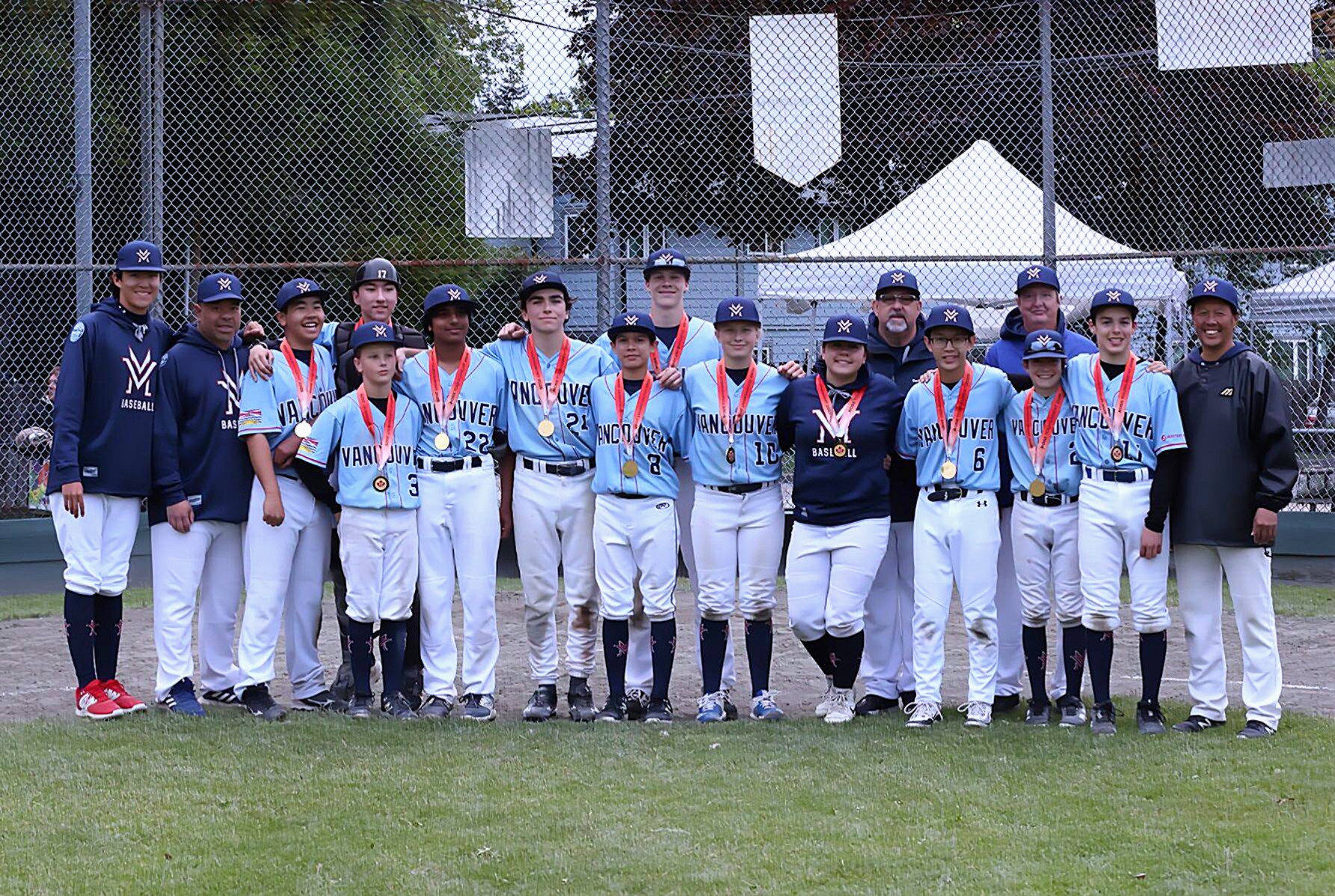 Ross Tournament champions photo featuring the VMB 15U AA Blue roster on the diamond.