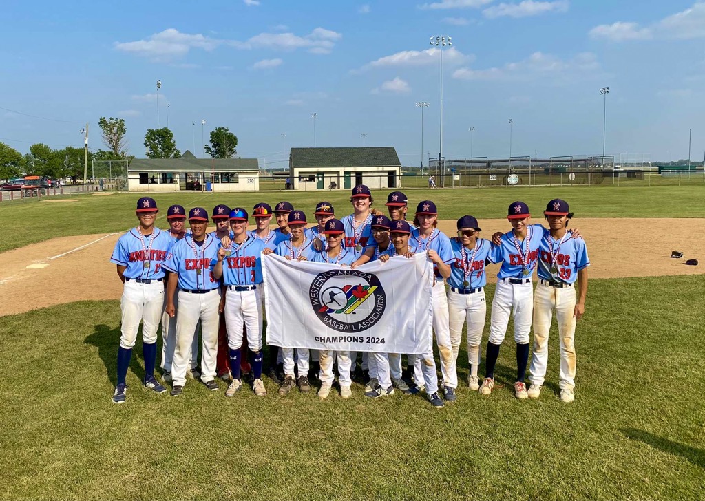 Vancouver Minor Baseball players celebrating a big win under the lights.